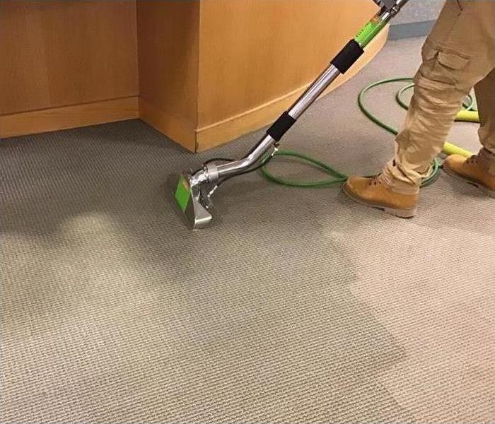 One of our technicians extracting water damage from the carpet 